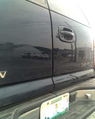 mike's paintless repair suburban after